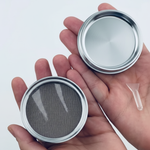 Silver chrome grinder with mesh screen and components